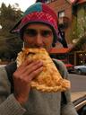 Maciej enjoying the mother of all empanadas!